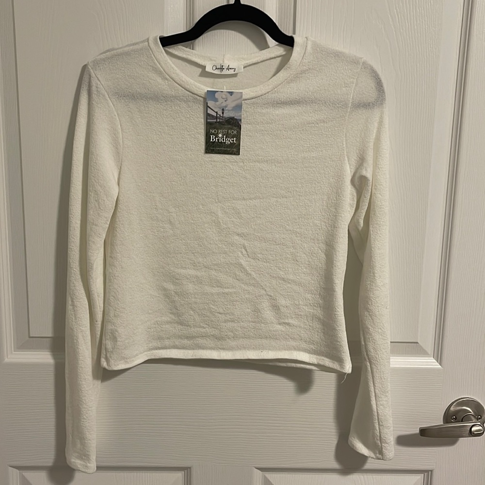 White long sleeve shirt in a soft woven fabric.